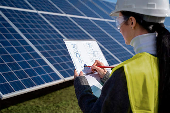 an expert inspecting the solar panels